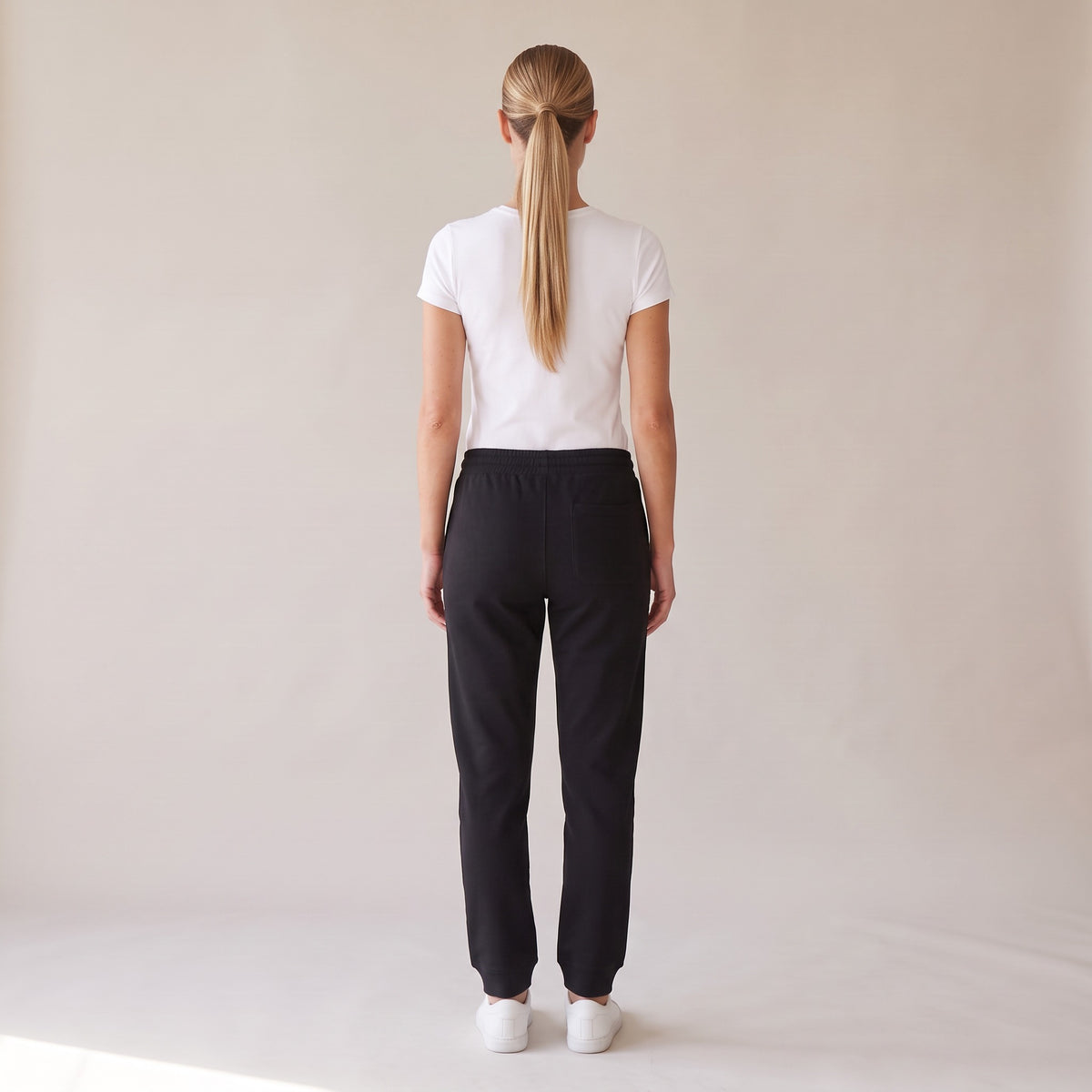 Basecamp Heavyweight Sweatpants — AWSM Field in Onyx Black, back view on the AWSM house model