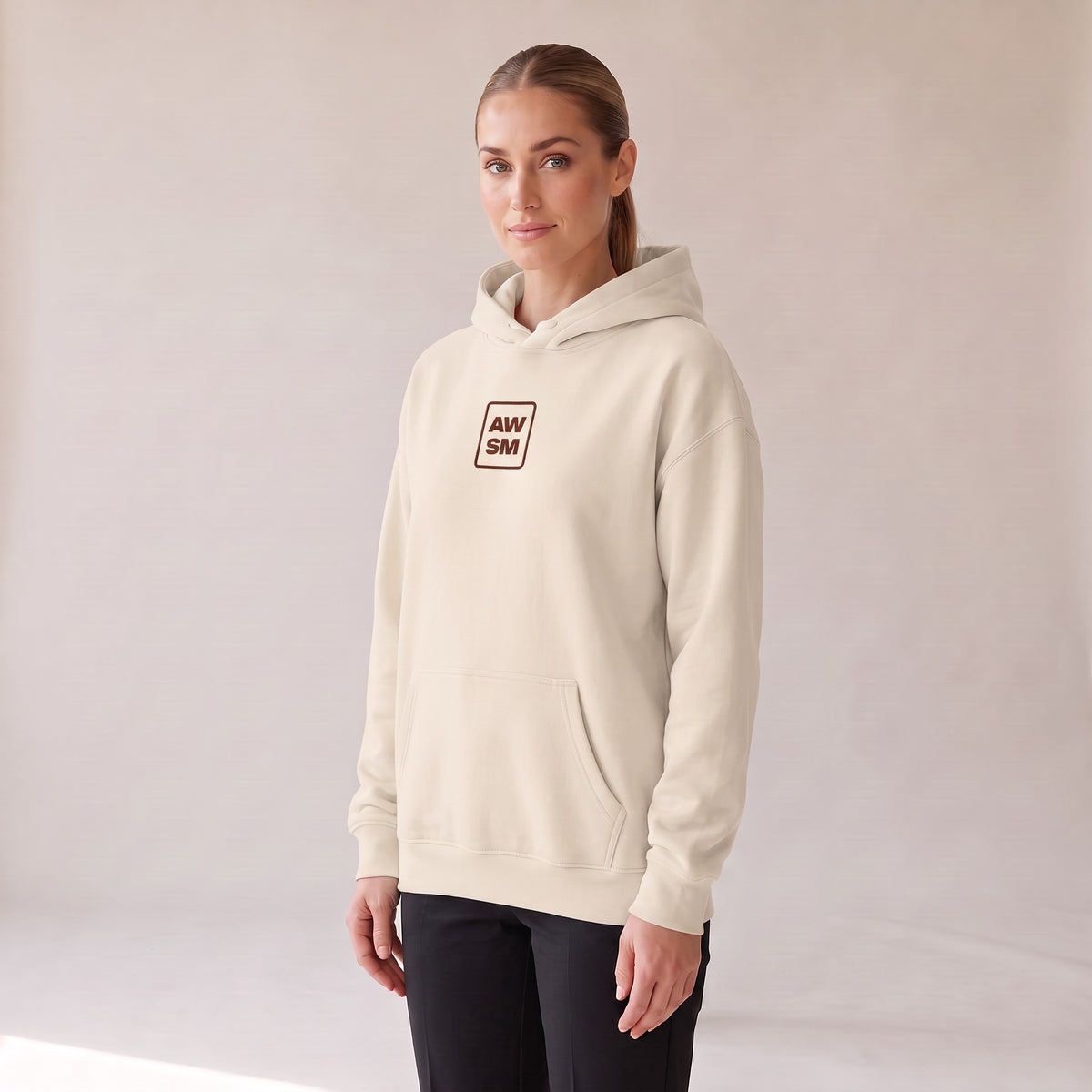 Bordeaux Relaxed Hoodie — AWSM Atelier in Bone White, three-quarter view on the AWSM house model