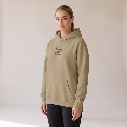 Bordeaux Relaxed Hoodie — AWSM Atelier in Dune Sand, three-quarter view on the AWSM house model