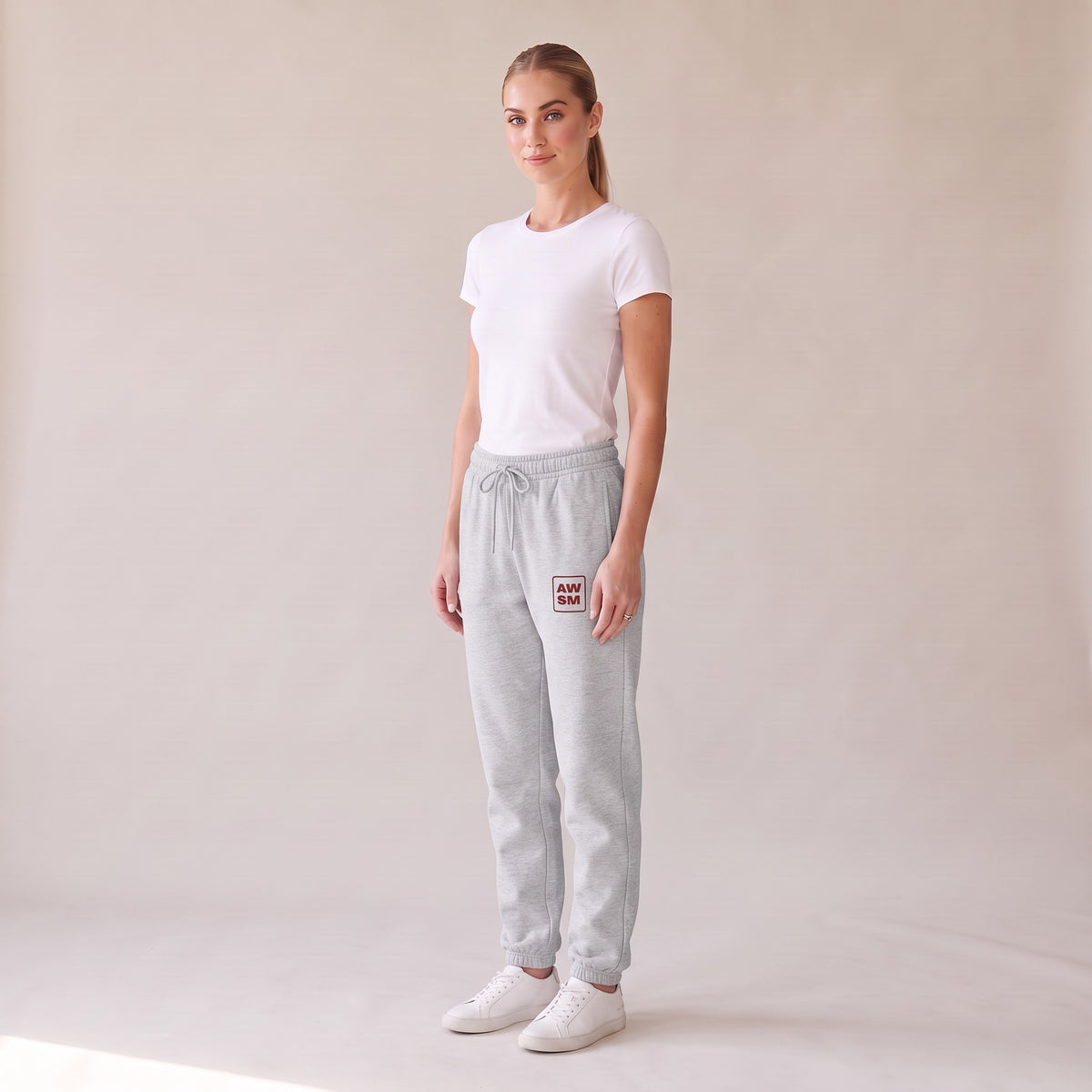 Cabernet Heavyweight Sweatpants — AWSM Atelier in Athletic Heather Grey, three-quarter view on the AWSM house model