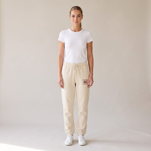 Cabernet Heavyweight Sweatpants — AWSM Atelier in Stone Dust, shown on the AWSM house model