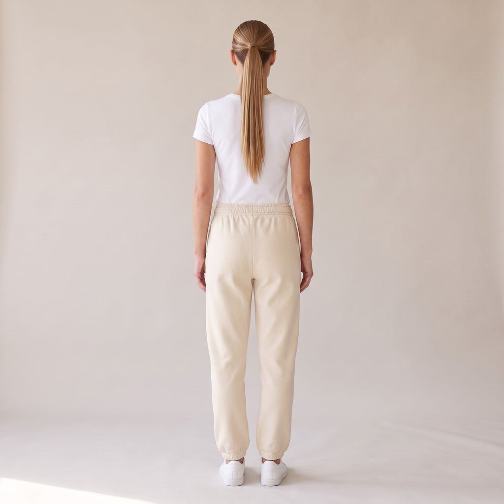 Cabernet Heavyweight Sweatpants — AWSM Atelier in Stone Dust, back view on the AWSM house model