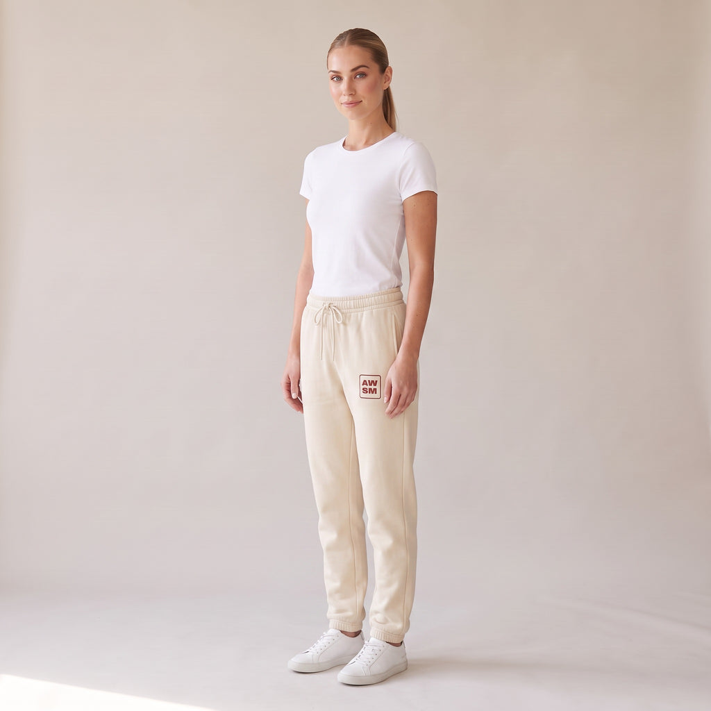 Cabernet Heavyweight Sweatpants — AWSM Atelier in Stone Dust, three-quarter view on the AWSM house model