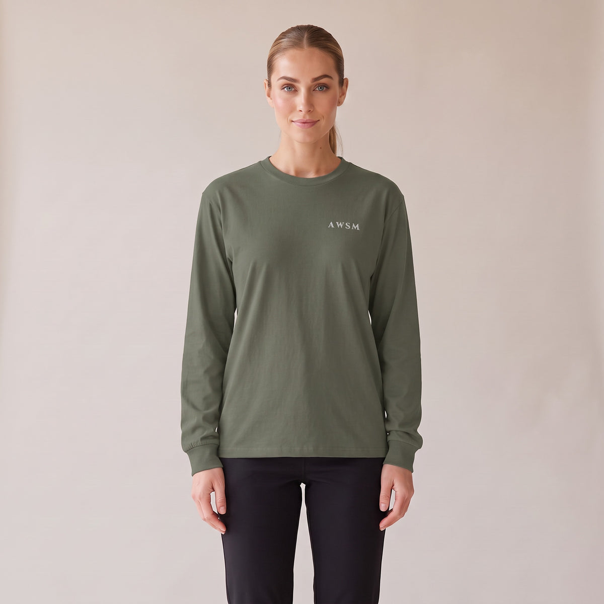Crépuscule Long Sleeve Tee — AWSM Maison in Cypress Green, front view on the AWSM house model