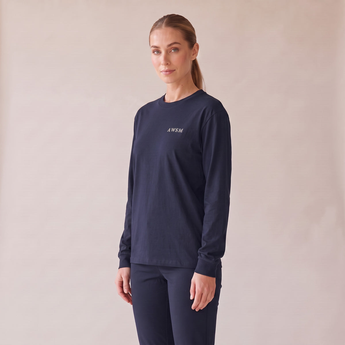 Crépuscule Long Sleeve Tee — AWSM Maison in Midnight Blue, three-quarter view on the AWSM house model