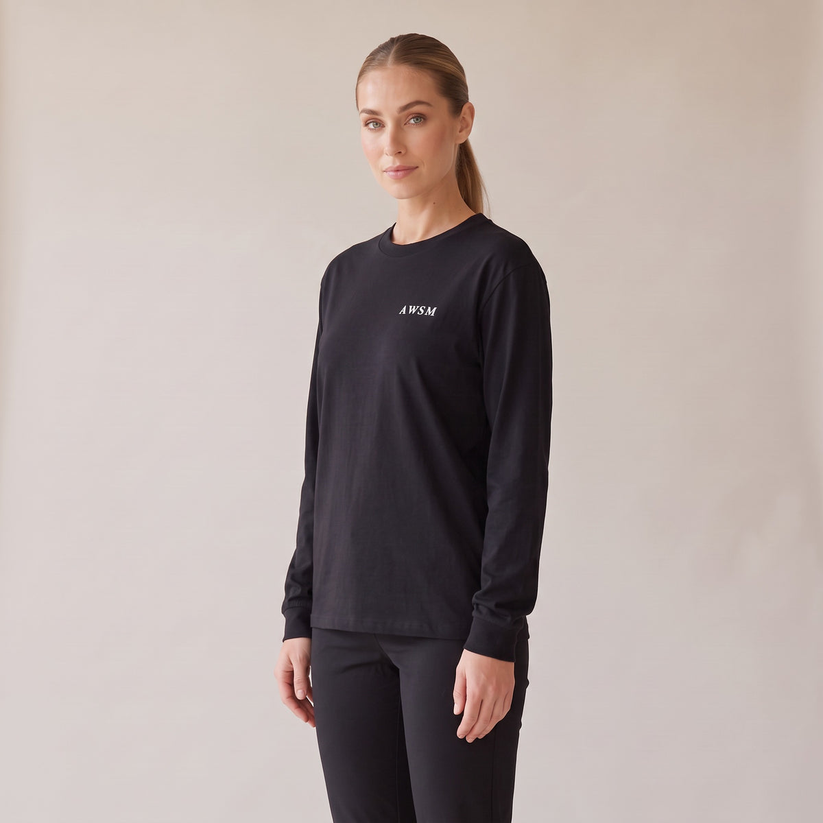 Crépuscule Long Sleeve Tee — AWSM Maison in Onyx Black, three-quarter view on the AWSM house model