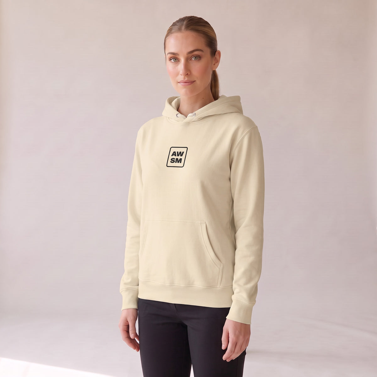 Galerie Hoodie — AWSM Atelier in Bone White, three-quarter view on the AWSM house model