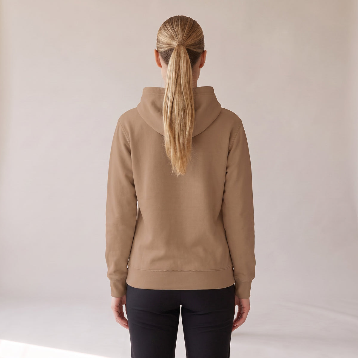 Galerie Hoodie — AWSM Atelier in Café Latte, back view on the AWSM house model