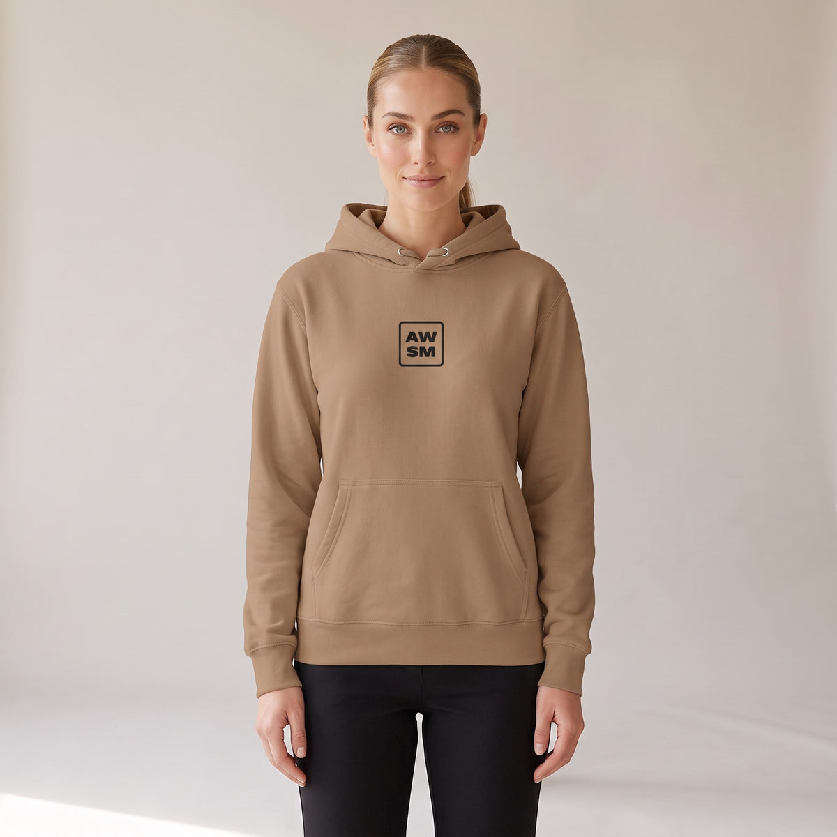 Galerie Hoodie — AWSM Atelier in Café Latte, shown on the AWSM house model
