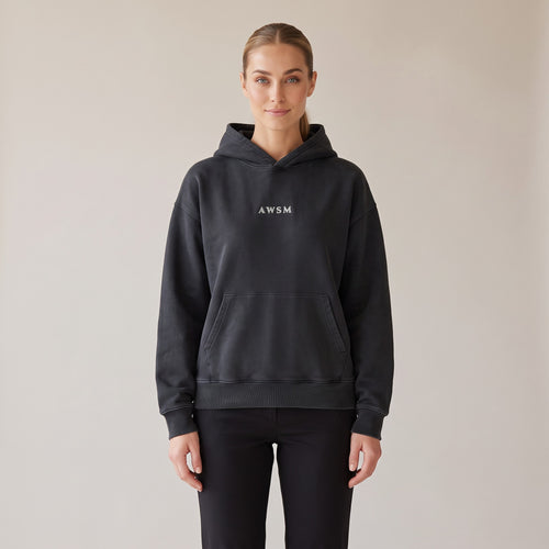 Héritage Vintage Hoodie — AWSM Maison in Volcanic Black, shown on the AWSM house model