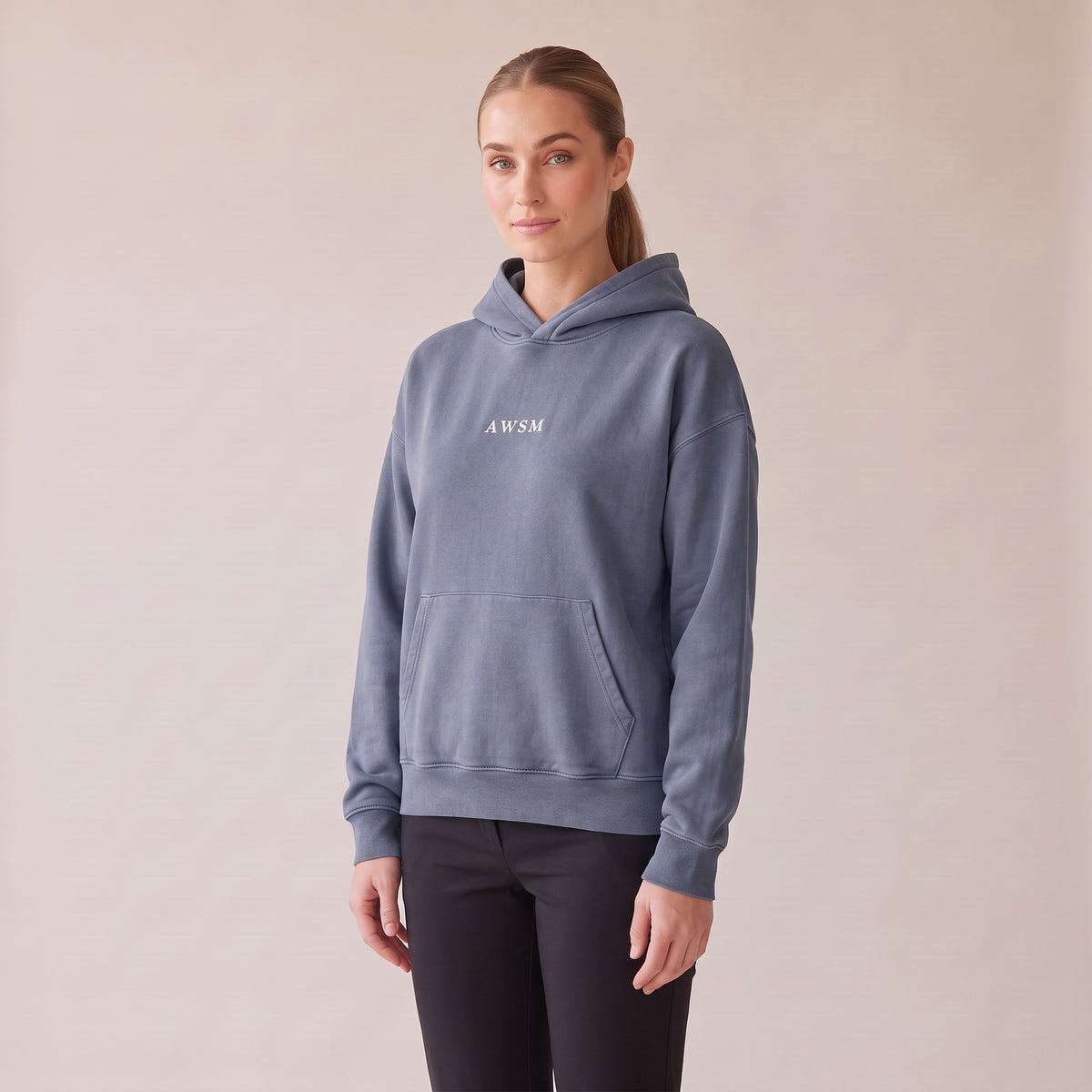 Héritage Vintage Hoodie — AWSM Maison in Storm Blue, three-quarter view on the AWSM house model