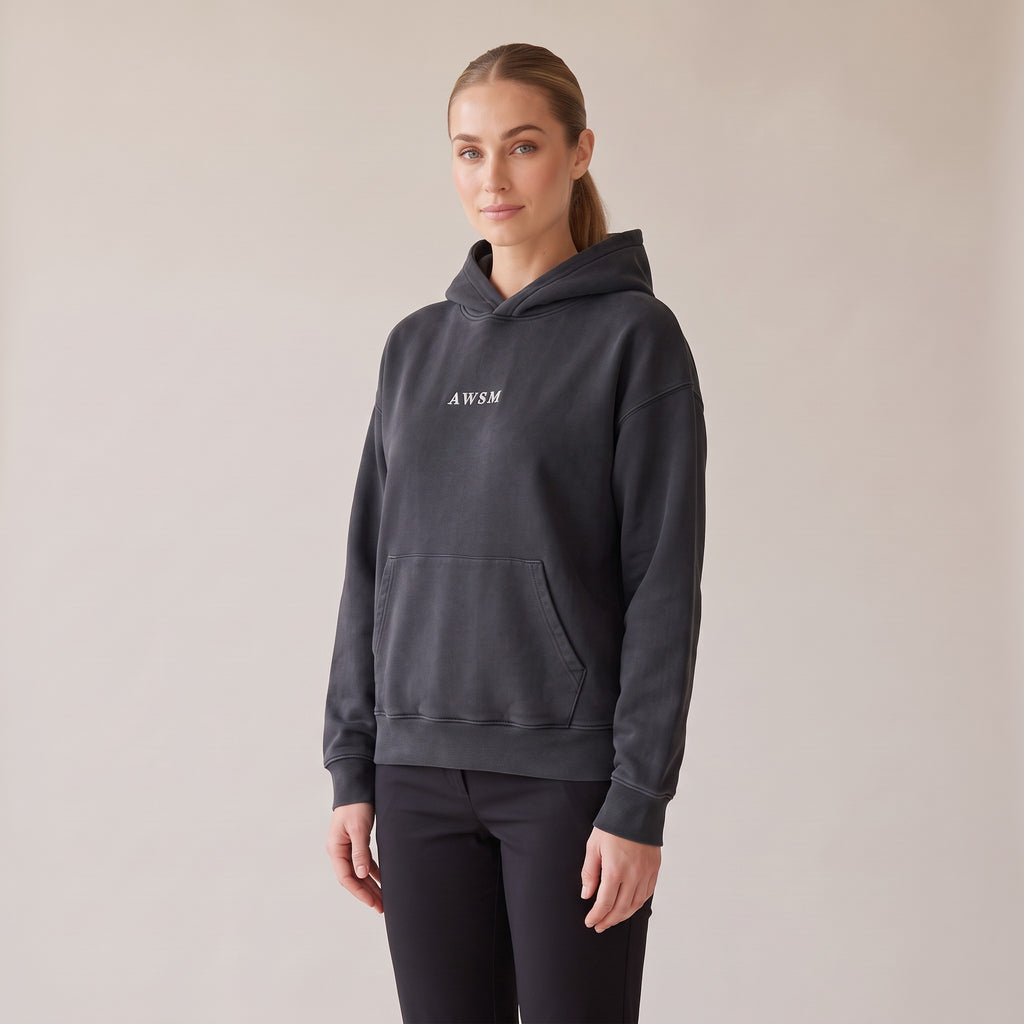 Héritage Vintage Hoodie — AWSM Maison in Volcanic Black, three-quarter view on the AWSM house model