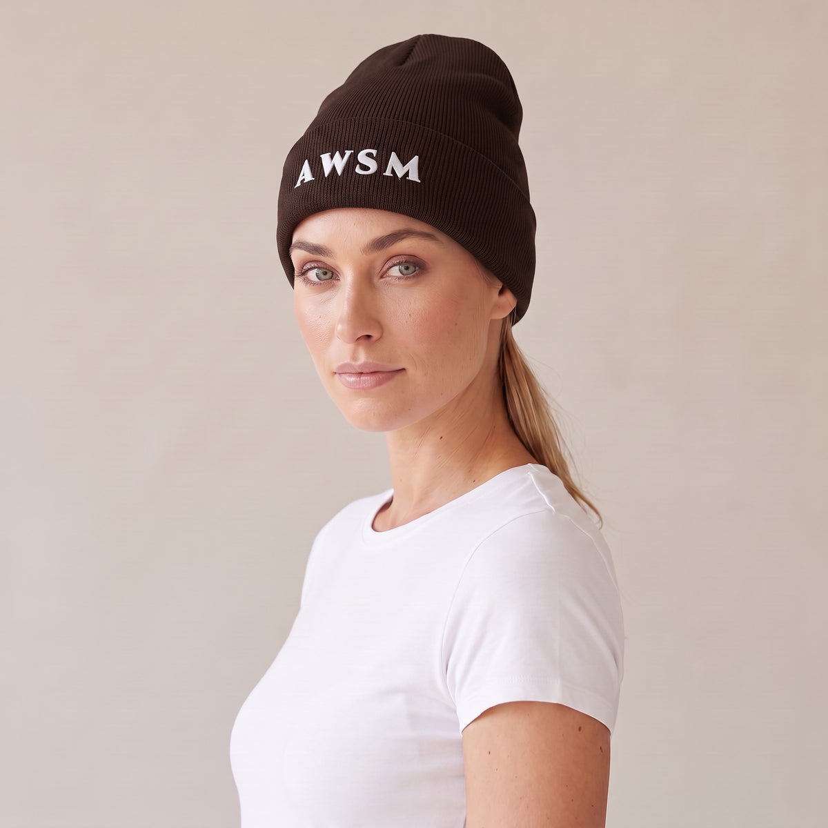 Hiver Cuffed Beanie — AWSM Maison in Chestnut Brown, three-quarter view on the AWSM house model