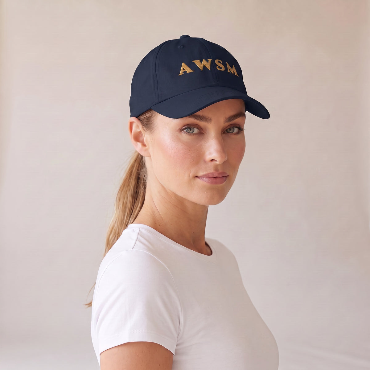 Laurel Dad Hat — AWSM Aurum in Midnight Navy, three-quarter view on the AWSM house model