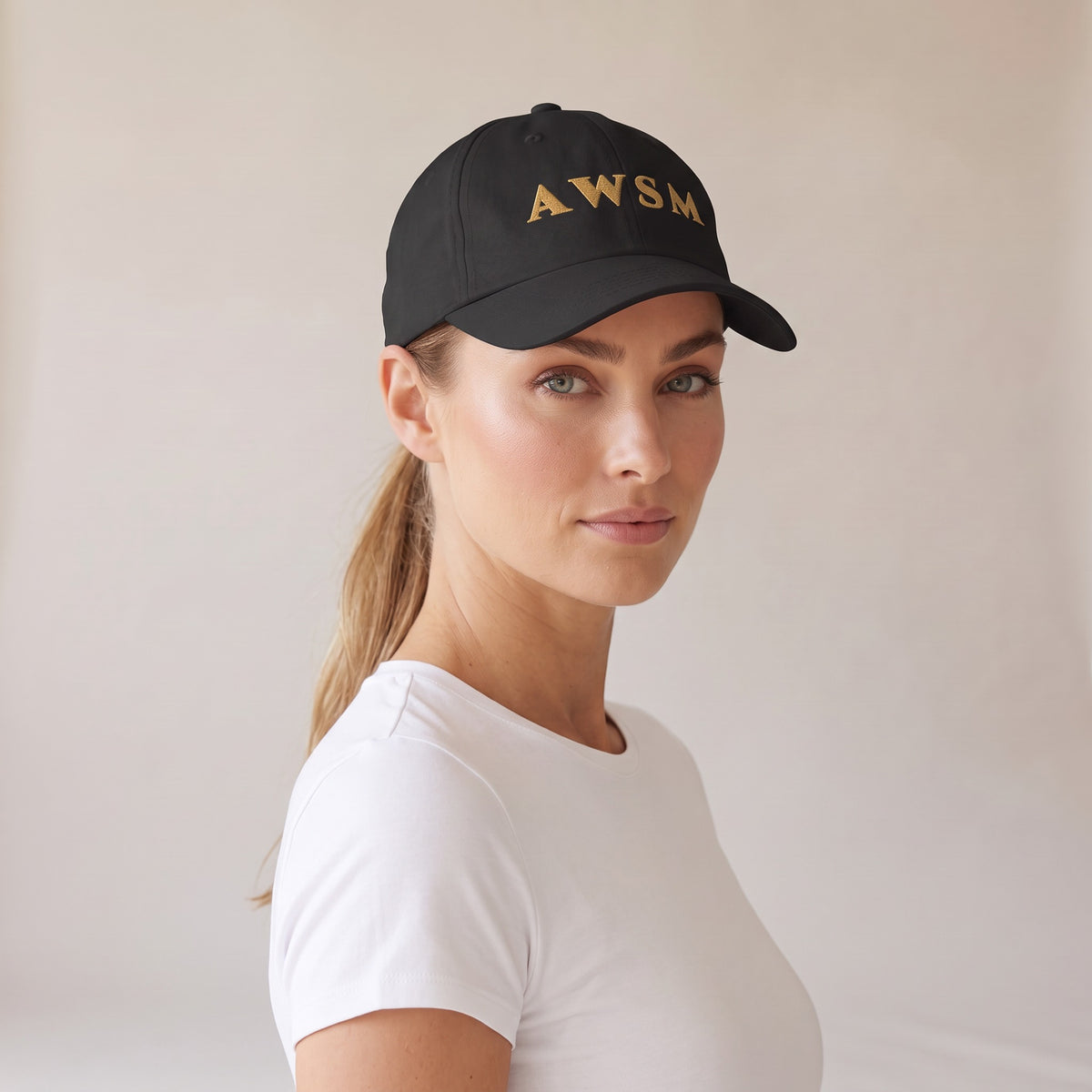 Laurel Dad Hat — AWSM Aurum in Onyx Black, three-quarter view on the AWSM house model