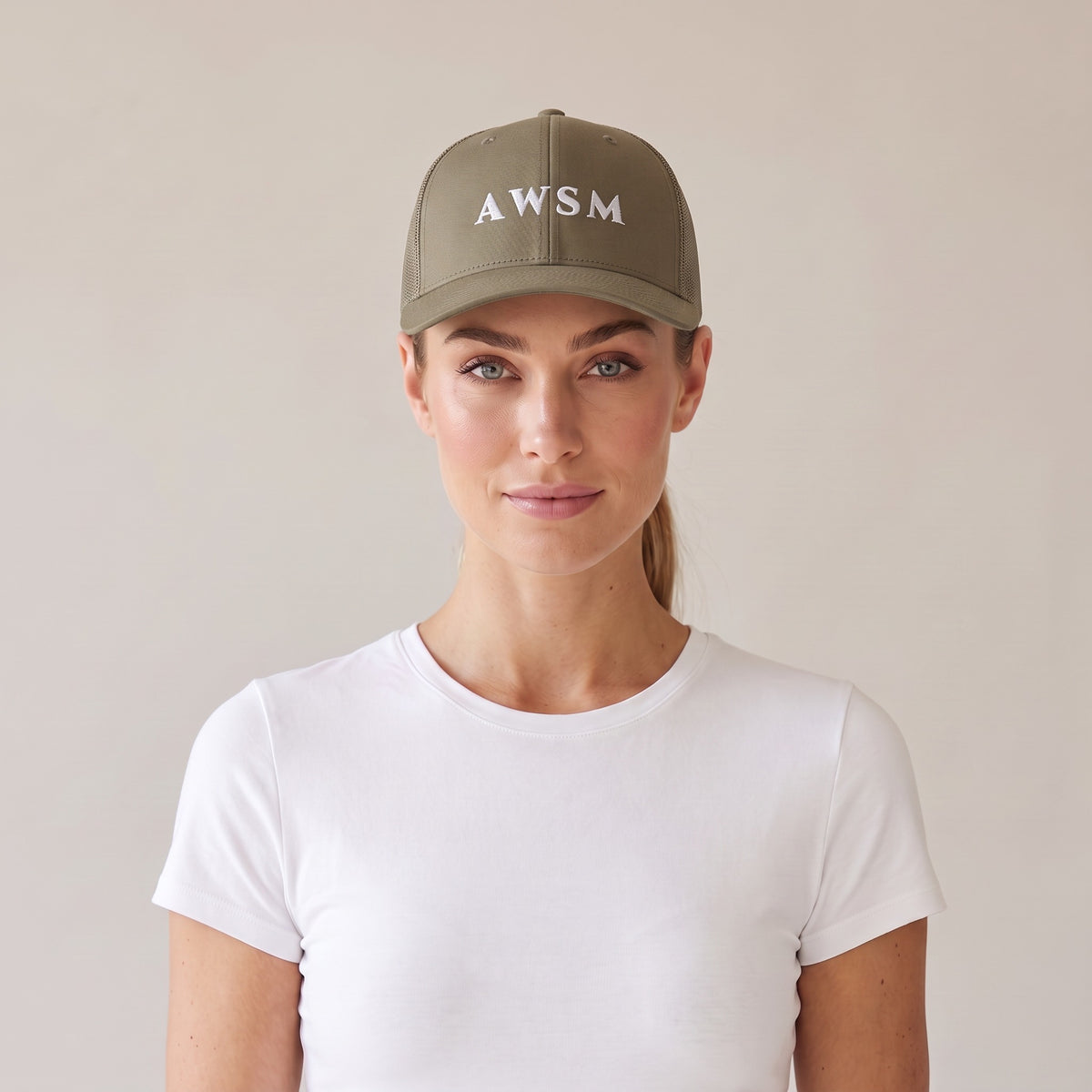 Minuit Trucker Cap — AWSM Maison in Loden Green, front view on the AWSM house model