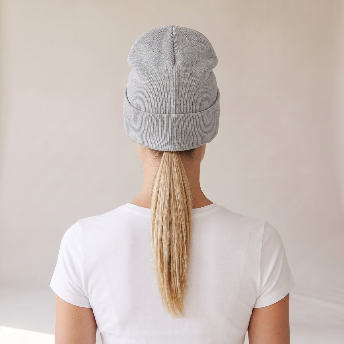 Neige Cuffed Beanie — AWSM Atelier in Cloud Heather Grey, back view on the AWSM house model