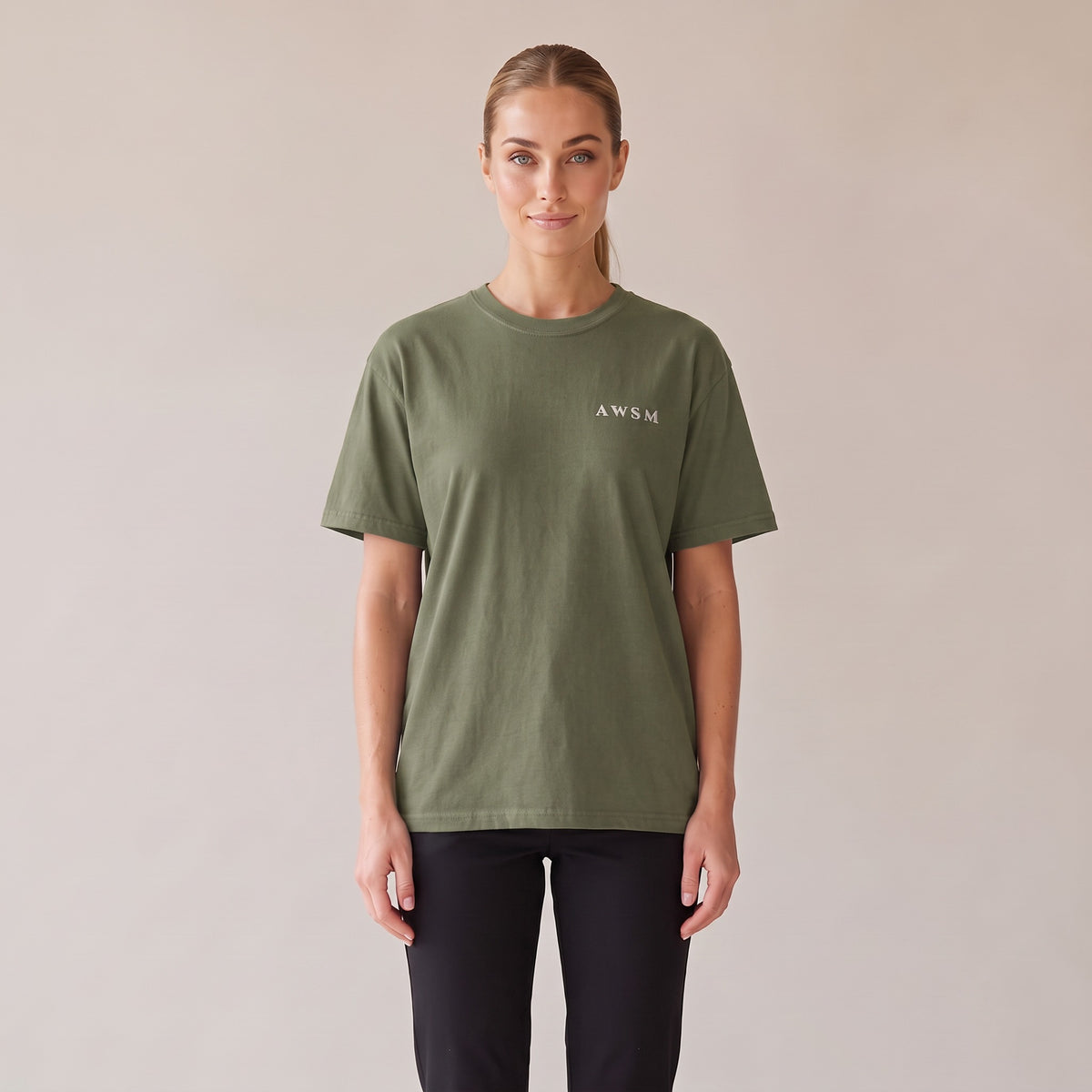 Nocturne Heavyweight Tee — AWSM Maison in Moss Green, front view on the AWSM house model