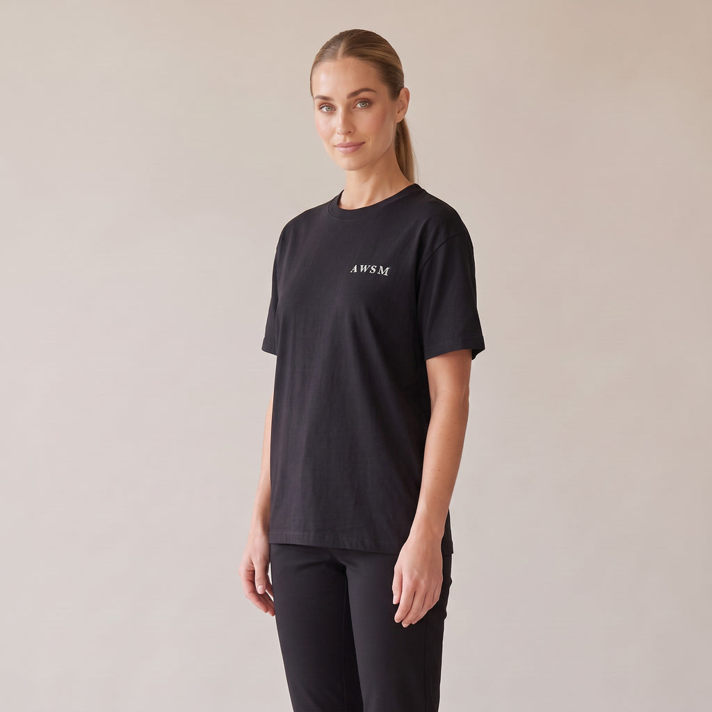Nocturne Heavyweight Tee — AWSM Maison in Onyx Black, three-quarter view on the AWSM house model