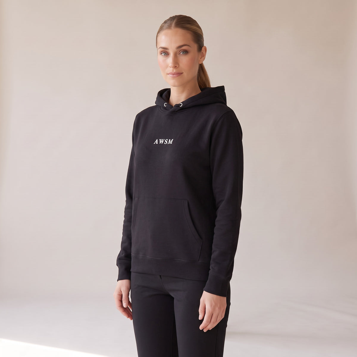 Opéra Hoodie — AWSM Maison in Onyx Black, three-quarter view on the AWSM house model