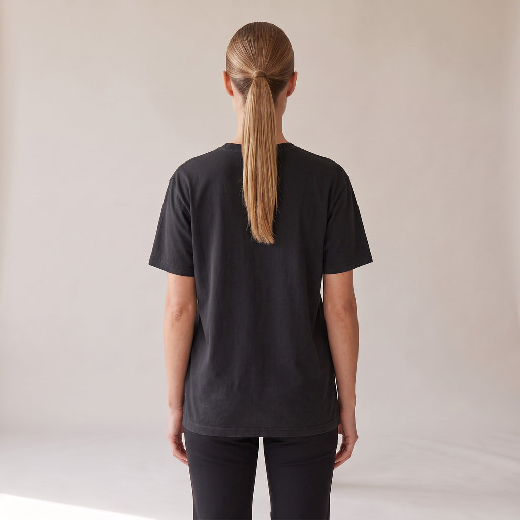 Outpost Heavyweight Tee — AWSM Field in Onyx Black, back view on the AWSM house model