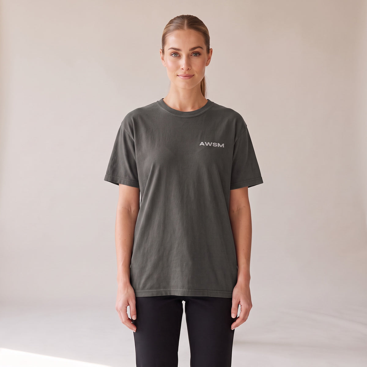 Outpost Heavyweight Tee — AWSM Field in Peppercorn Grey, front view on the AWSM house model