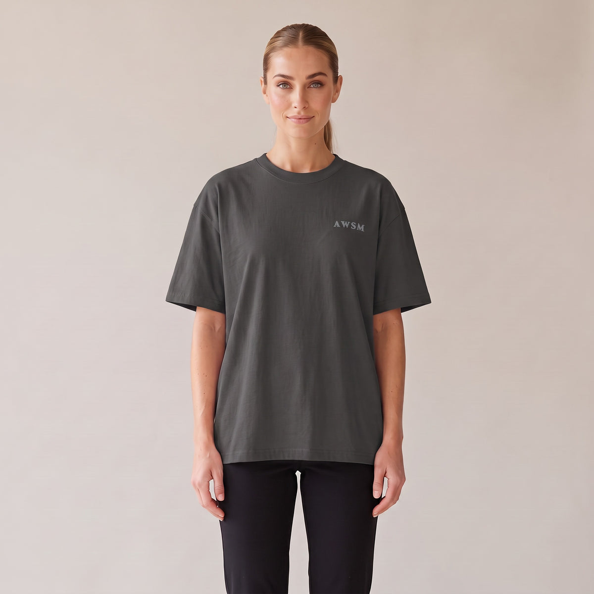 Patina Oversized Tee — AWSM Maison in Faded Coal, front view on the AWSM house model