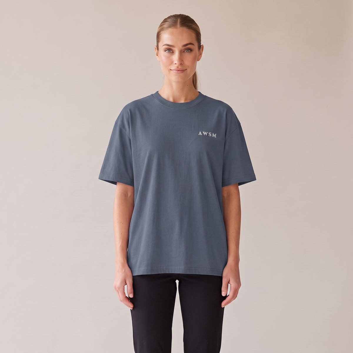 Patina Oversized Tee — AWSM Maison in Faded Indigo, front view on the AWSM house model