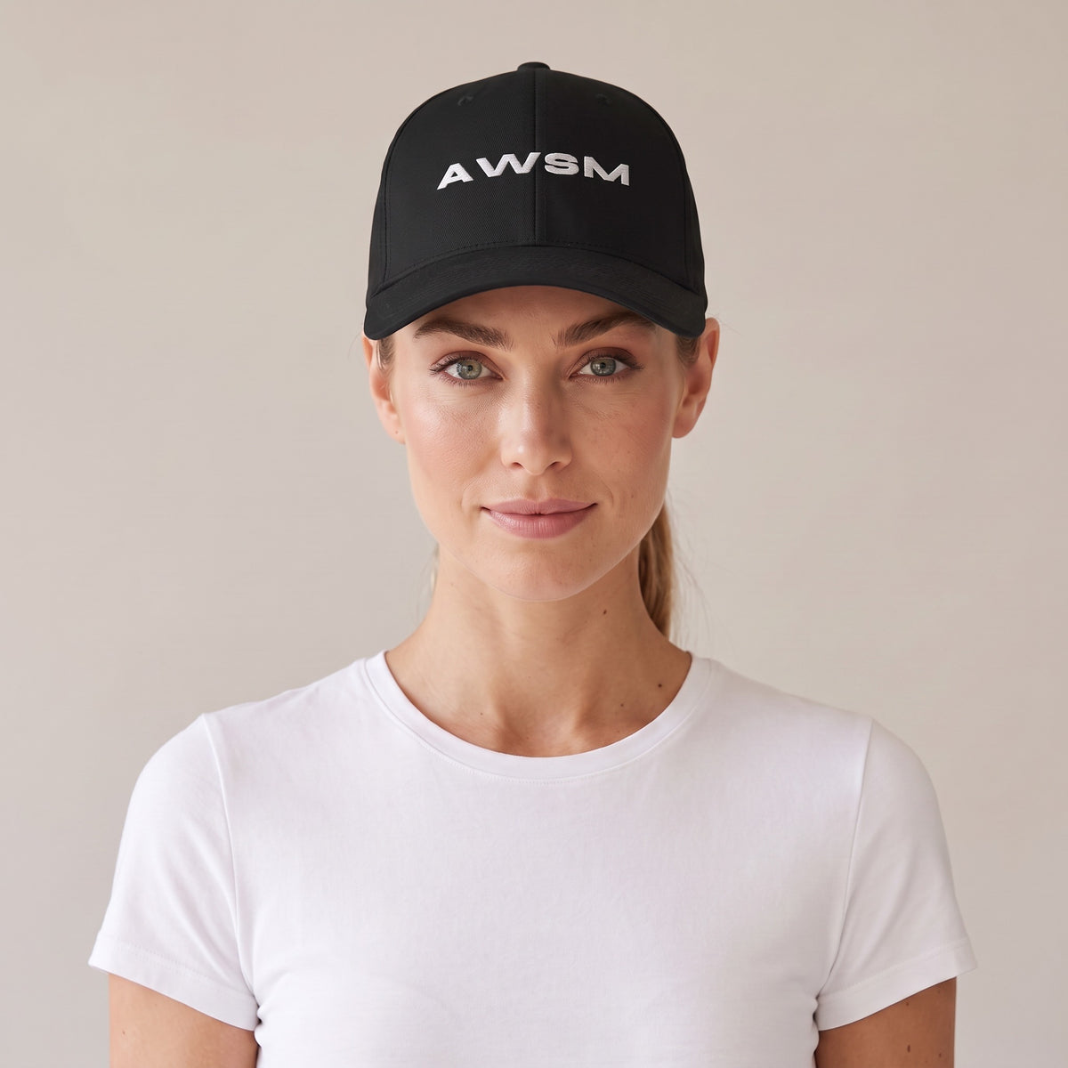 Recon Structured Cap — AWSM Field in Onyx Black, front view on the AWSM house model