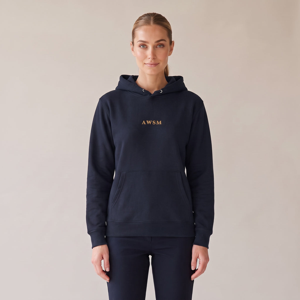 Regalia Hoodie — AWSM Aurum in Midnight Navy, front view on the AWSM house model