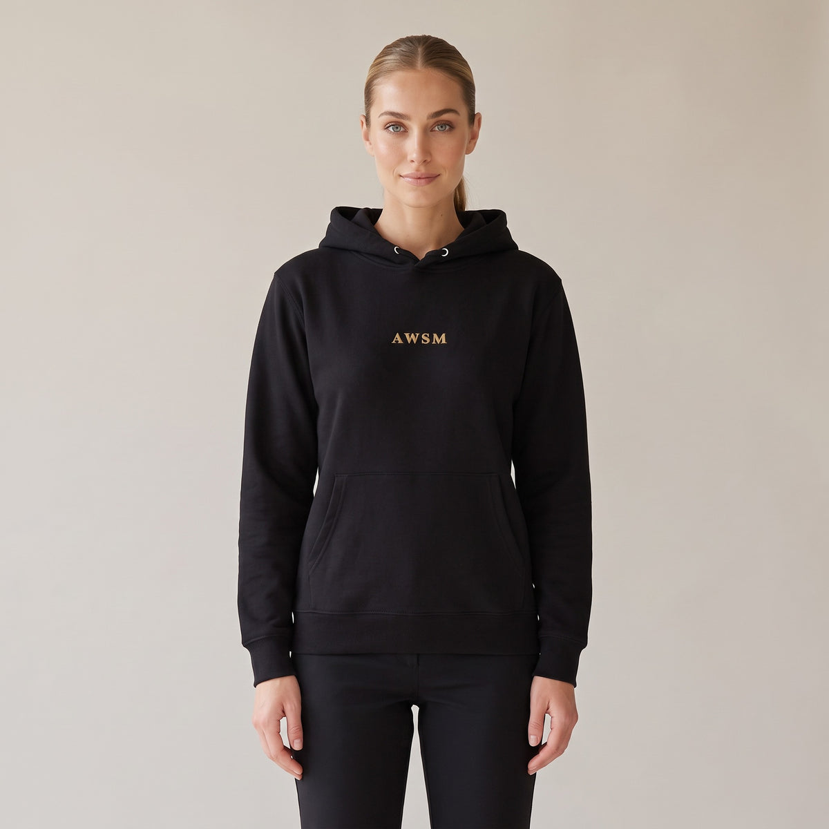 Regalia Hoodie — AWSM Aurum in Onyx Black, shown on the AWSM house model