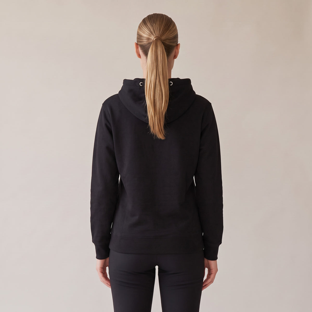 Regalia Hoodie — AWSM Aurum in Onyx Black, back view on the AWSM house model