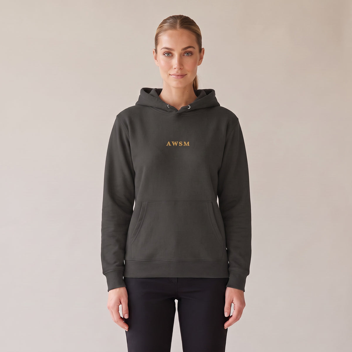 Regalia Hoodie — AWSM Aurum in Washed Onyx, front view on the AWSM house model