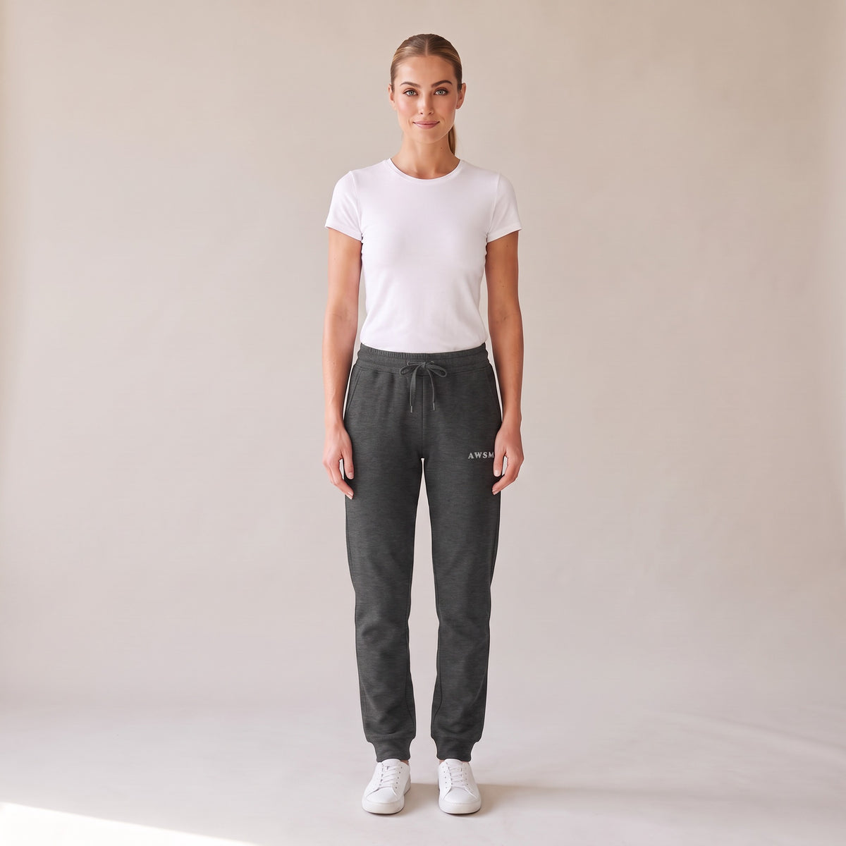 Repos Fleece Sweatpants — AWSM Maison in Charcoal Heather, front view on the AWSM house model