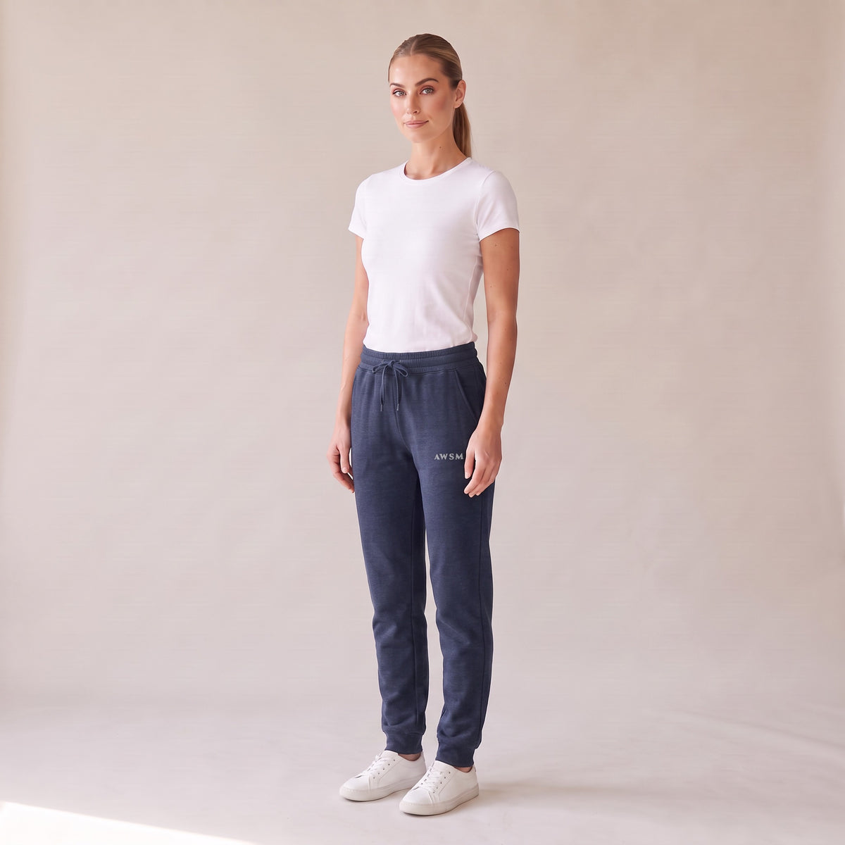 Repos Fleece Sweatpants — AWSM Maison in Midnight Navy, three-quarter view on the AWSM house model