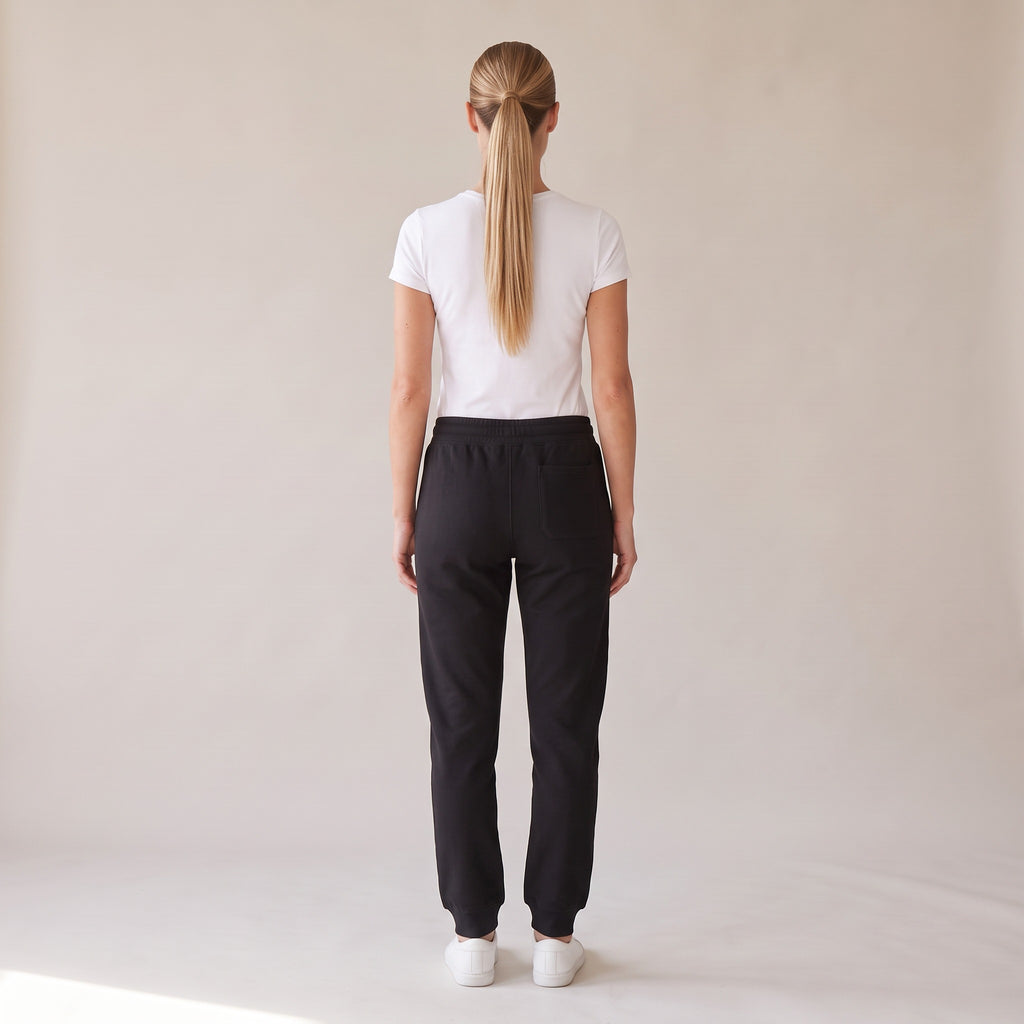 Repos Fleece Sweatpants — AWSM Maison in Onyx Black, back view on the AWSM house model