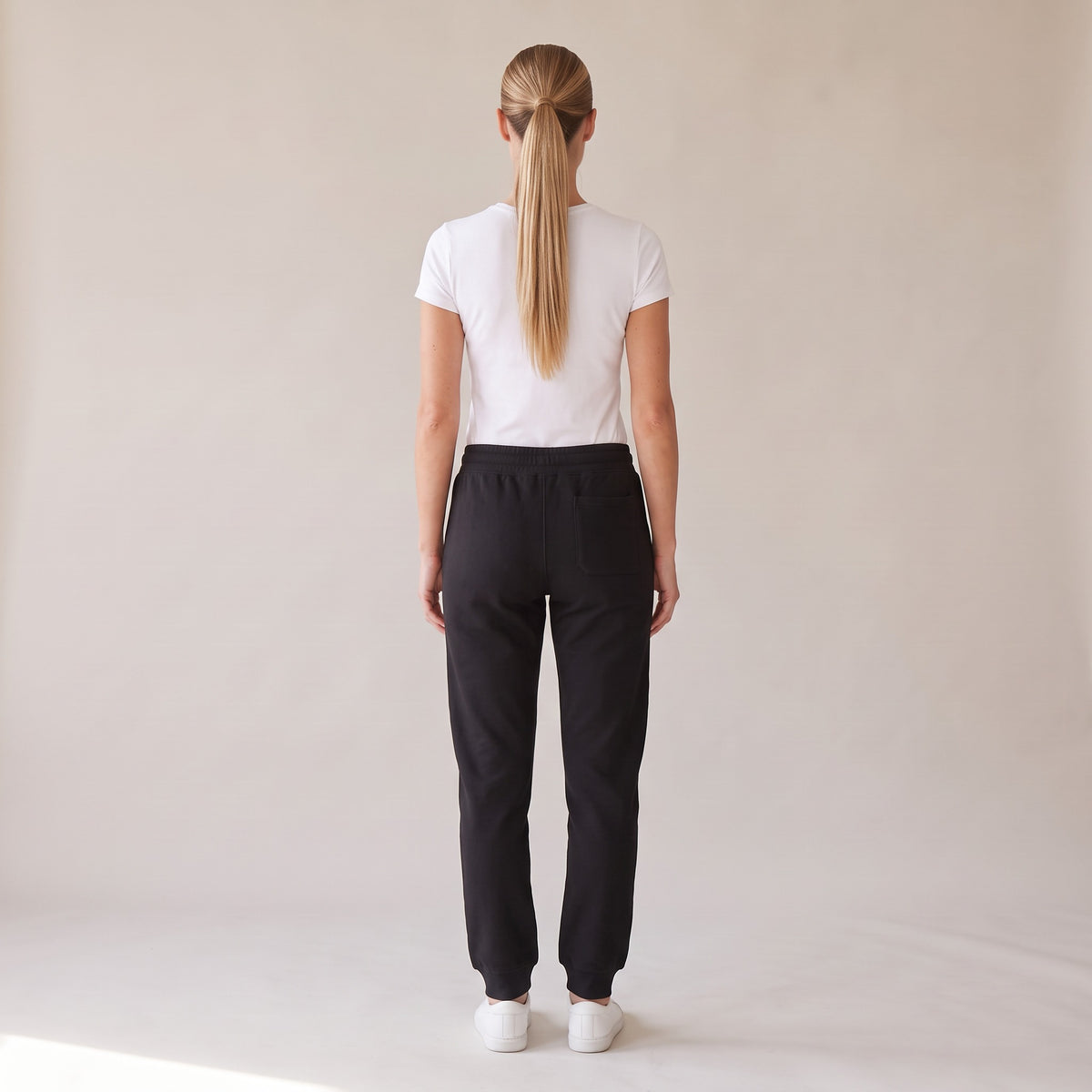 Repos Fleece Sweatpants — AWSM Maison in Onyx Black, back view on the AWSM house model