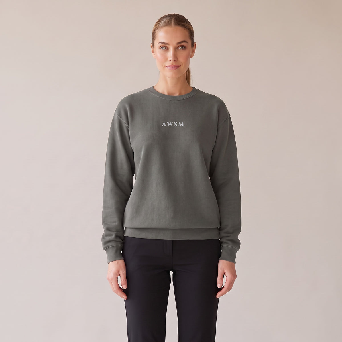 Salon Crewneck — AWSM Maison in Peppercorn Grey, front view on the AWSM house model