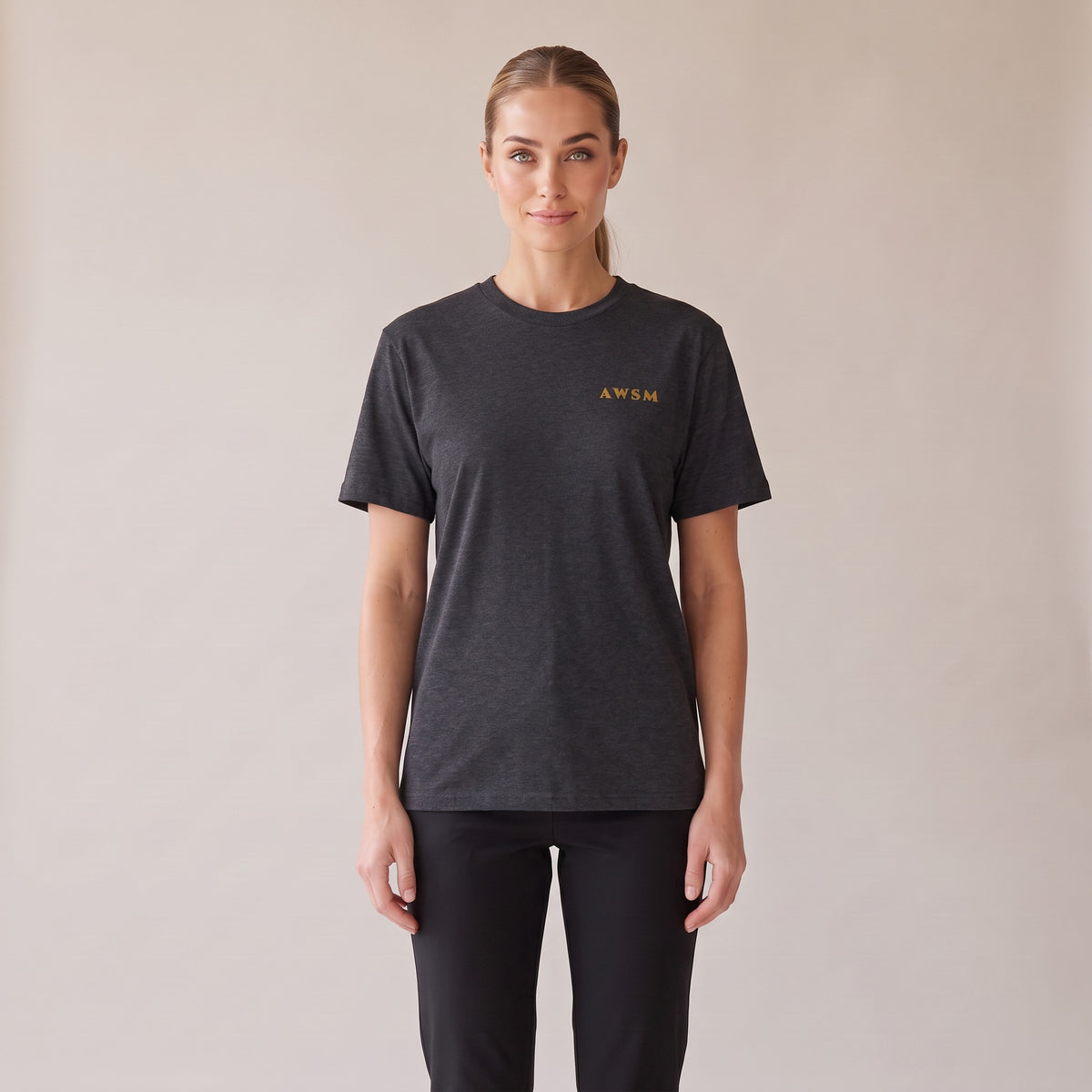 Sovereign Heavyweight Tee — AWSM Aurum in Charcoal Heather, front view on the AWSM house model