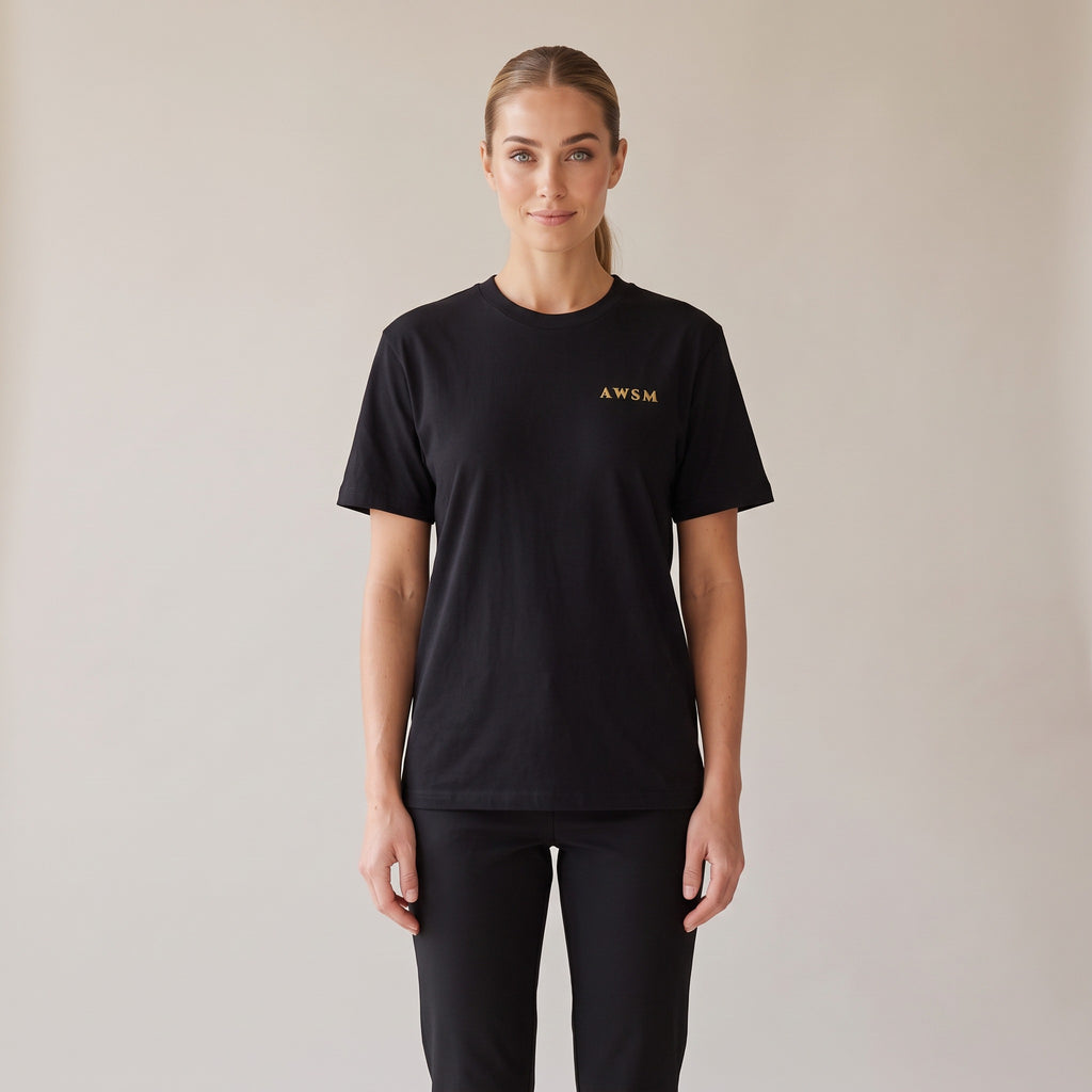 Sovereign Heavyweight Tee — AWSM Aurum in Onyx Black, shown on the AWSM house model