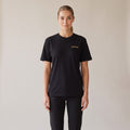 Sovereign Heavyweight Tee — AWSM Aurum in Onyx Black, shown on the AWSM house model