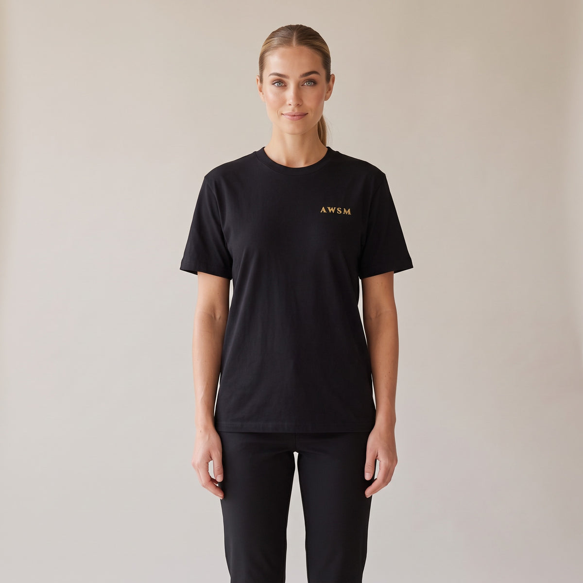 Sovereign Heavyweight Tee — AWSM Aurum in Onyx Black, shown on the AWSM house model