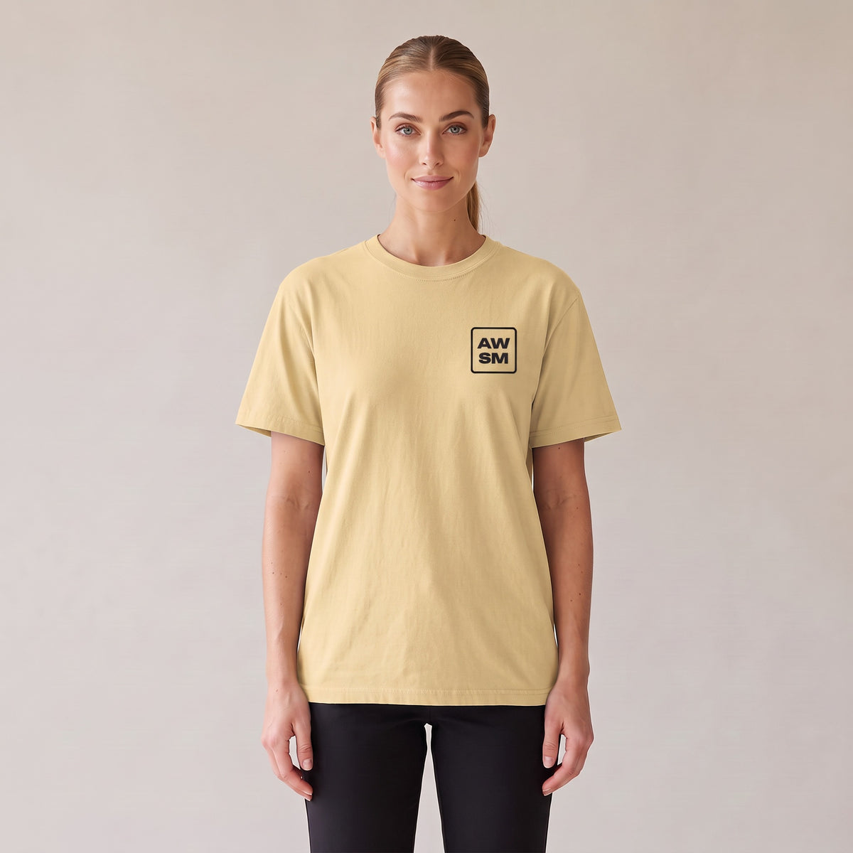 Studio Heavyweight Tee — AWSM Atelier in Butter Cream, front view on the AWSM house model