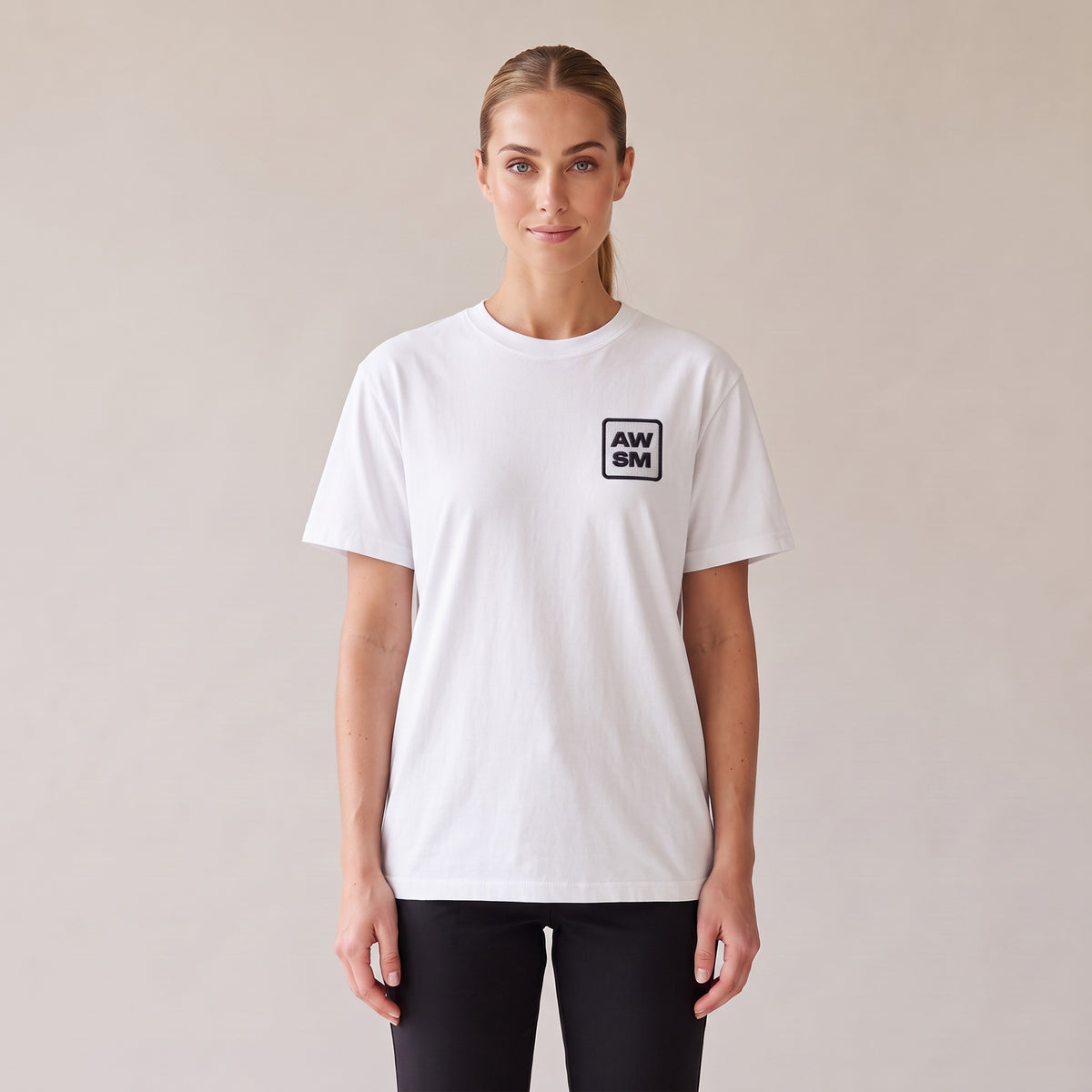 Studio Heavyweight Tee — AWSM Atelier in Pearl White, front view on the AWSM house model