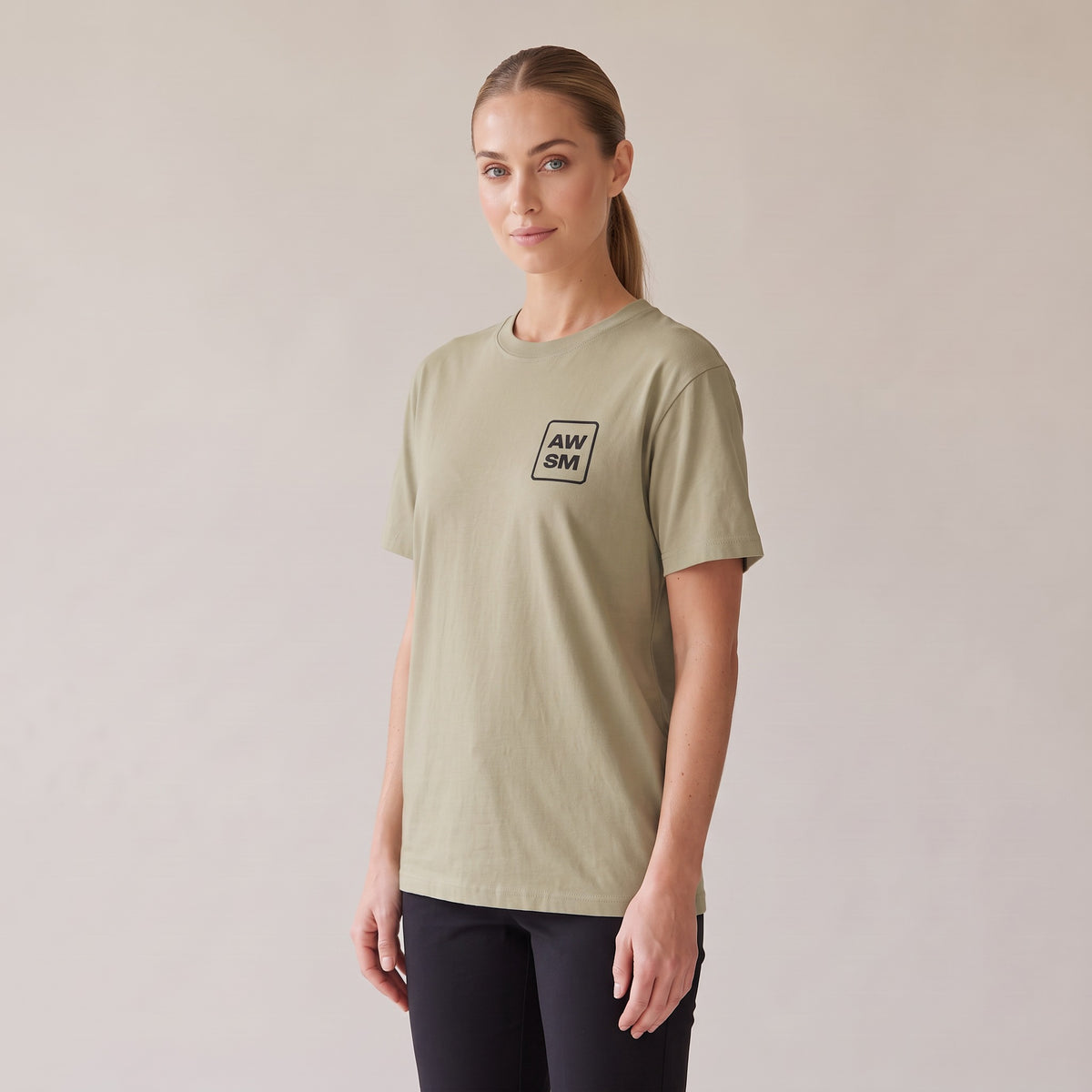 Studio Heavyweight Tee — AWSM Atelier in Sahara Khaki, three-quarter view on the AWSM house model