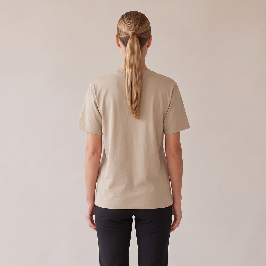 Terre Organic Tee — AWSM Atelier in Desert Dust, back view on the AWSM house model