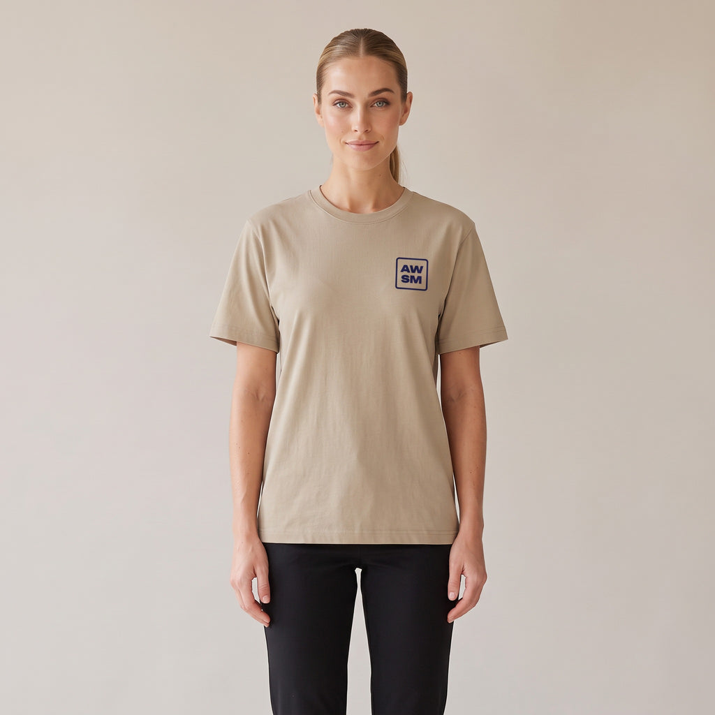 Terre Organic Tee — AWSM Atelier in Desert Dust, shown on the AWSM house model