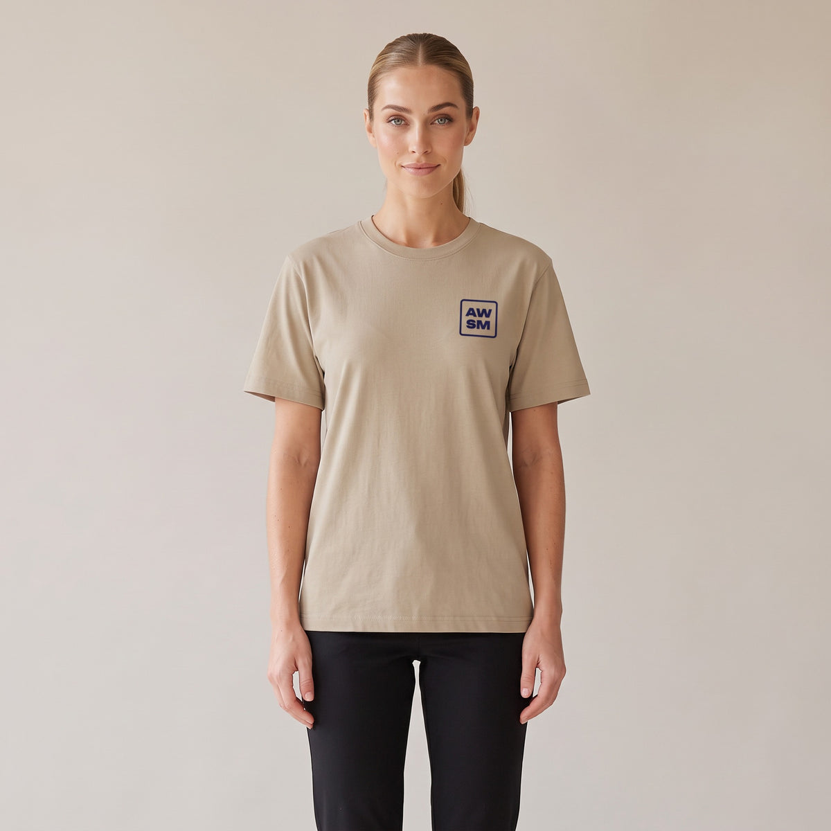 Terre Organic Tee — AWSM Atelier in Desert Dust, shown on the AWSM house model