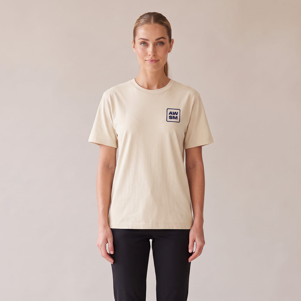 Terre Organic Tee — AWSM Atelier in Raw Natural, front view on the AWSM house model