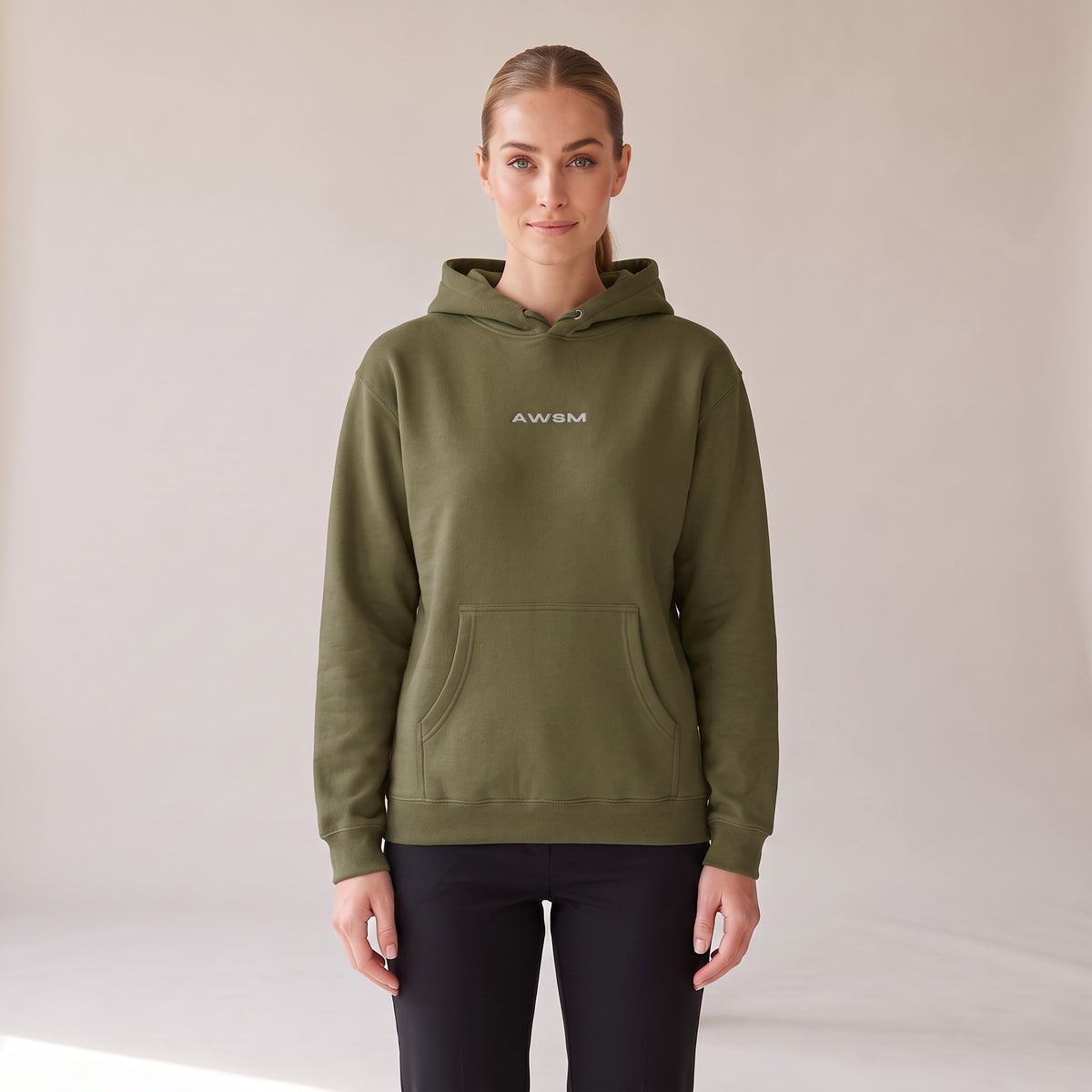 Vanguard Heavyweight Hoodie — AWSM Field in Army Green, front view on the AWSM house model